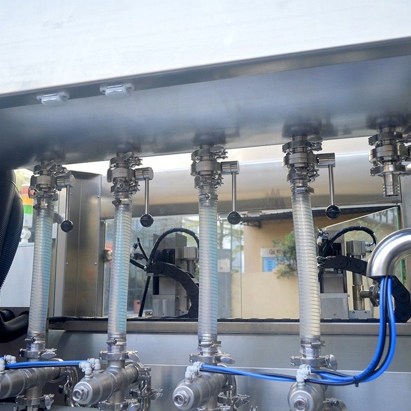 Machine de remplissage d'huile lubrifiante et de shampooing liquide à double tête de suivi